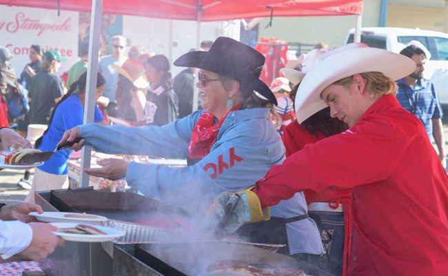 YYC serves up 2,450 pancakes to travellers at its annual Stampede Breakfast