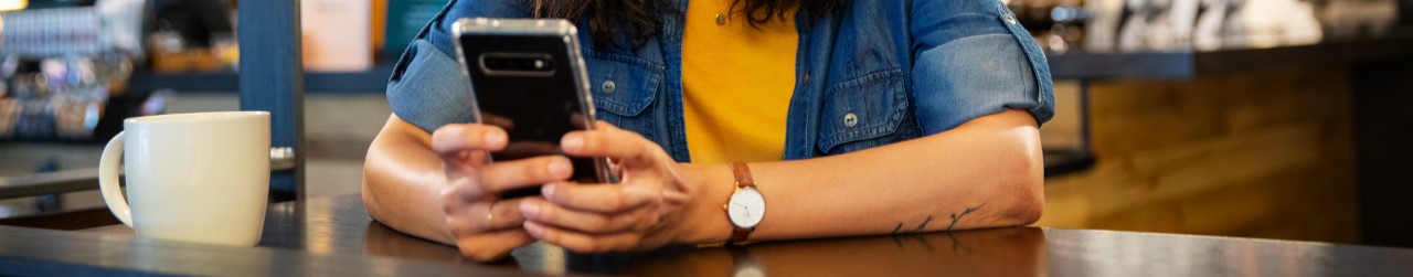 Photo of someone holding a cellphone. 